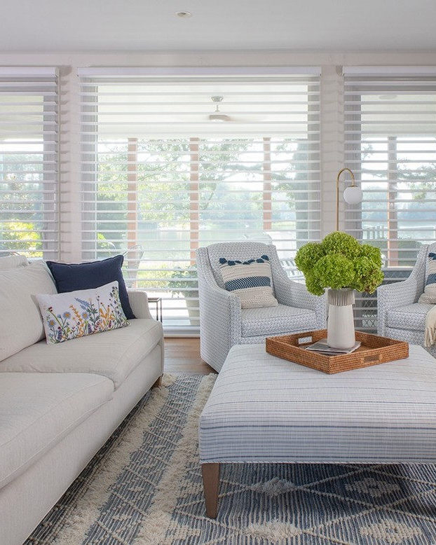 an image of a living room with large windows